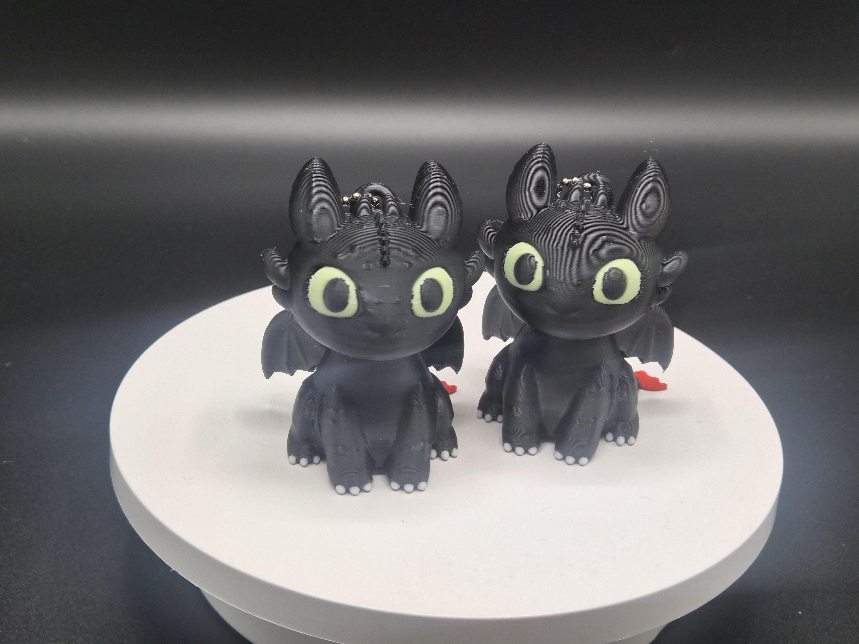 Toothless and Light Fury Clicker Keychains | How to Train Your Dragon
