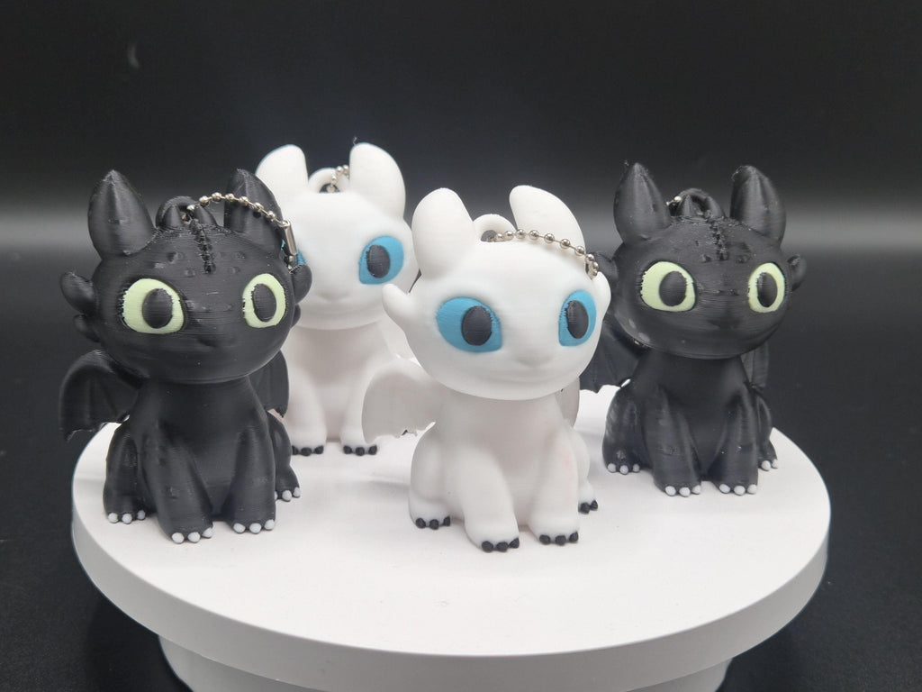 Toothless and Light Fury Clicker Keychains | How to Train Your Dragon