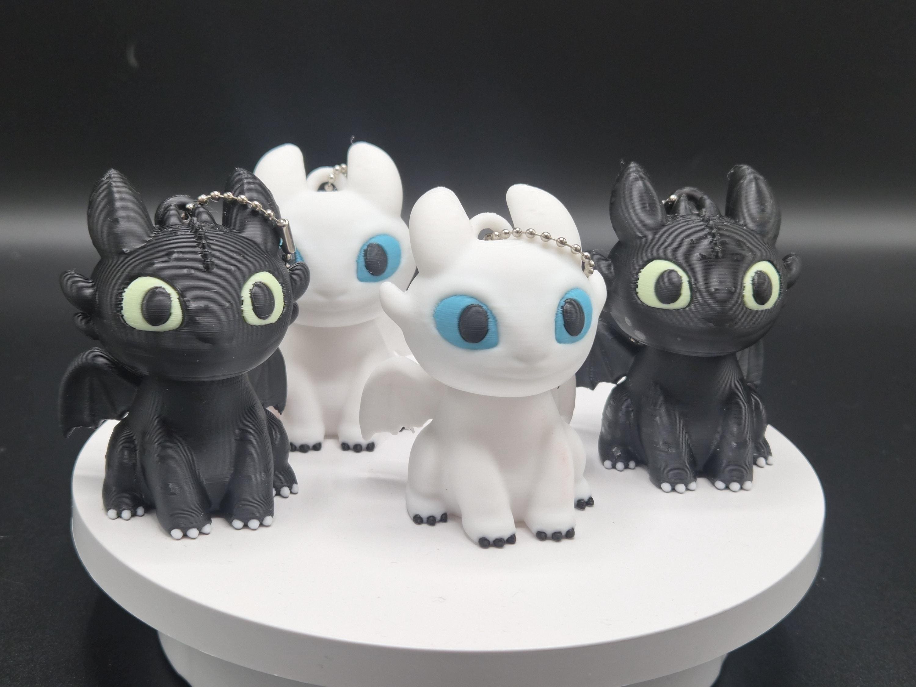 Toothless and Light Fury Clicker Keychains | How to Train Your Dragon