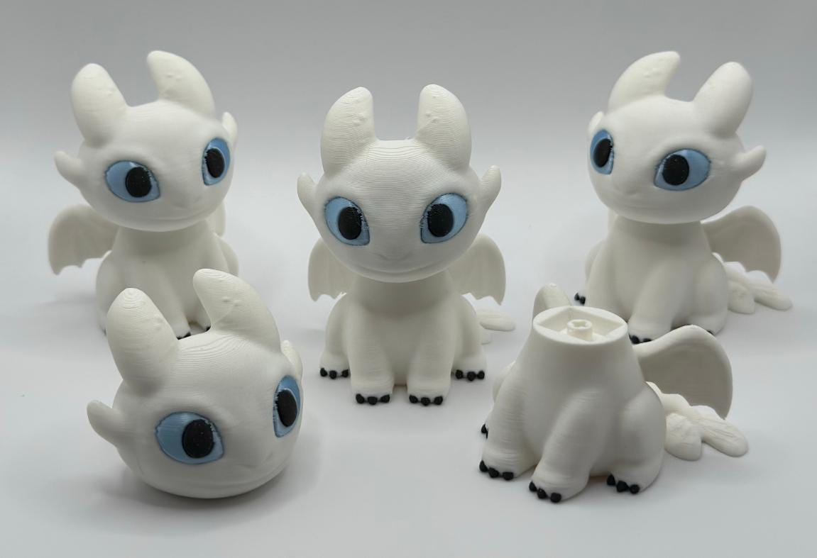 Toothless and Light Fury Clicker Keychains | How to Train Your Dragon