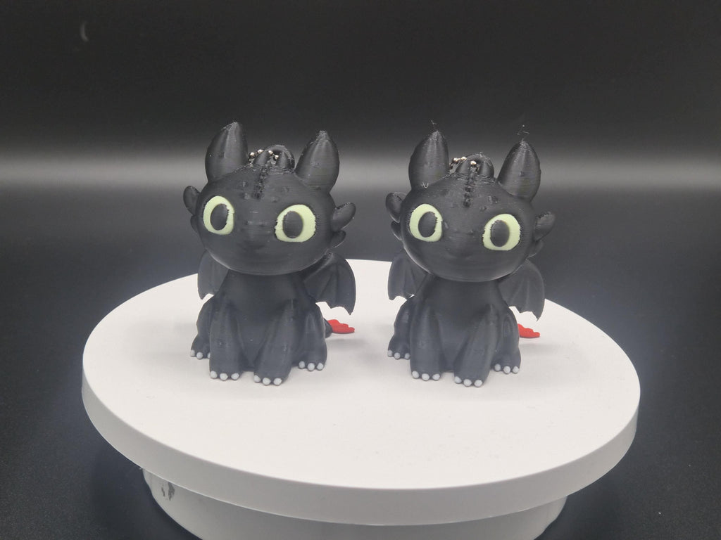 Toothless and Light Fury Clicker Keychains | How to Train Your Dragon