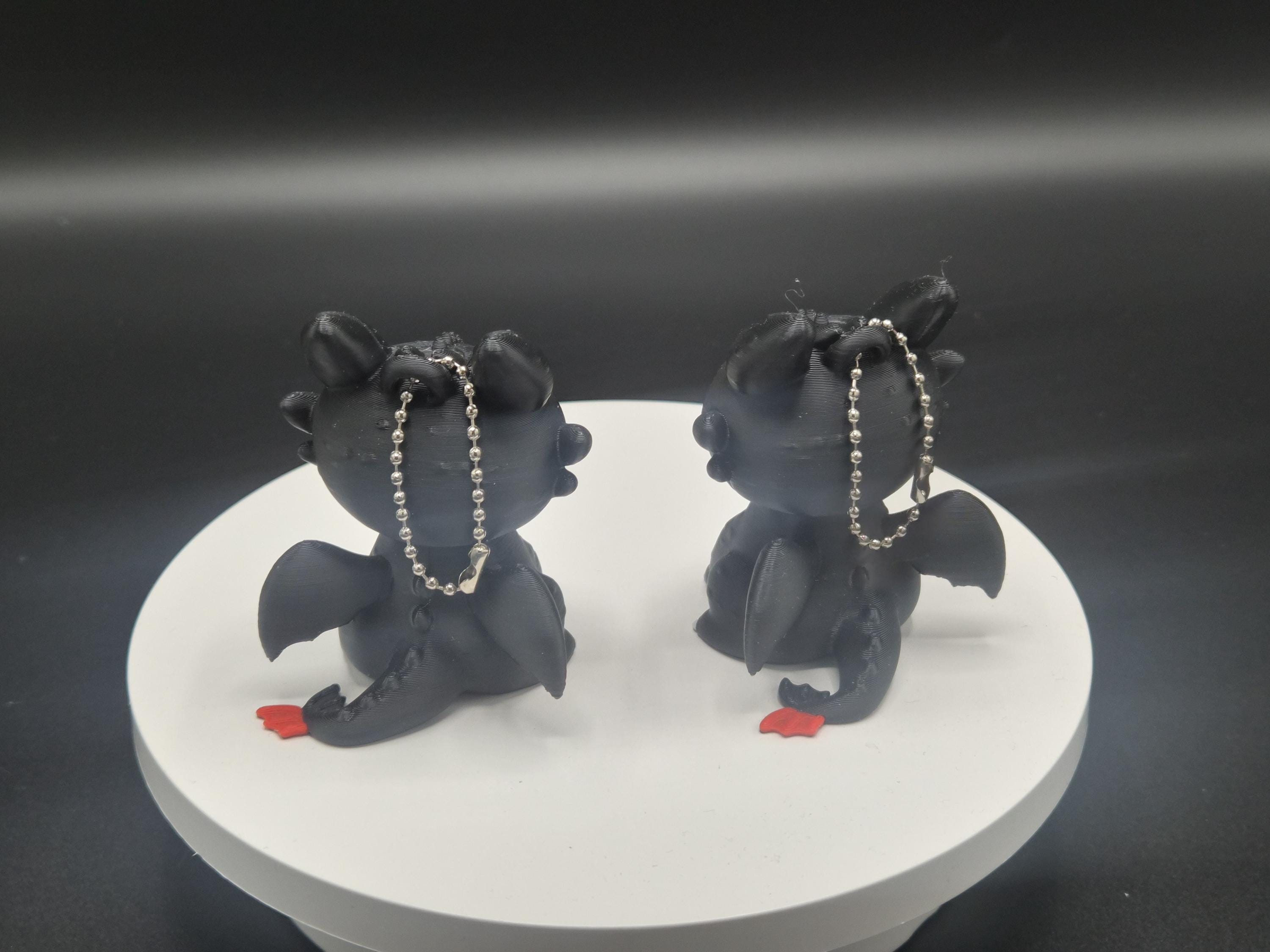 Toothless and Light Fury Clicker Keychains | How to Train Your Dragon