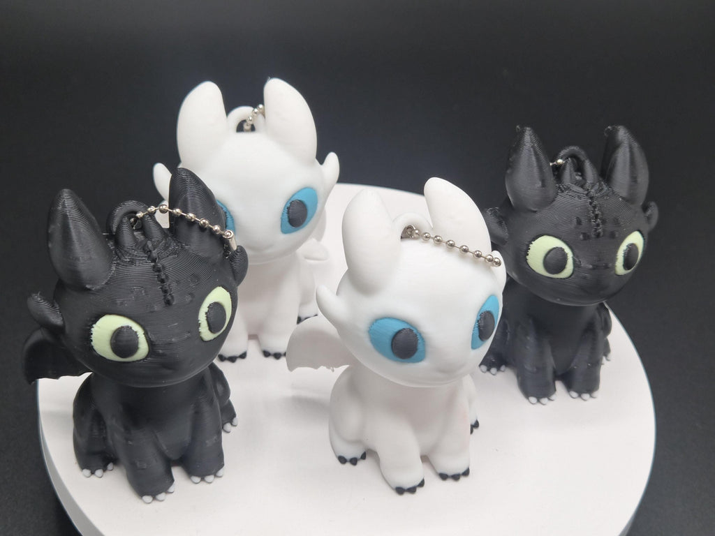 Toothless and Light Fury Clicker Keychains | How to Train Your Dragon